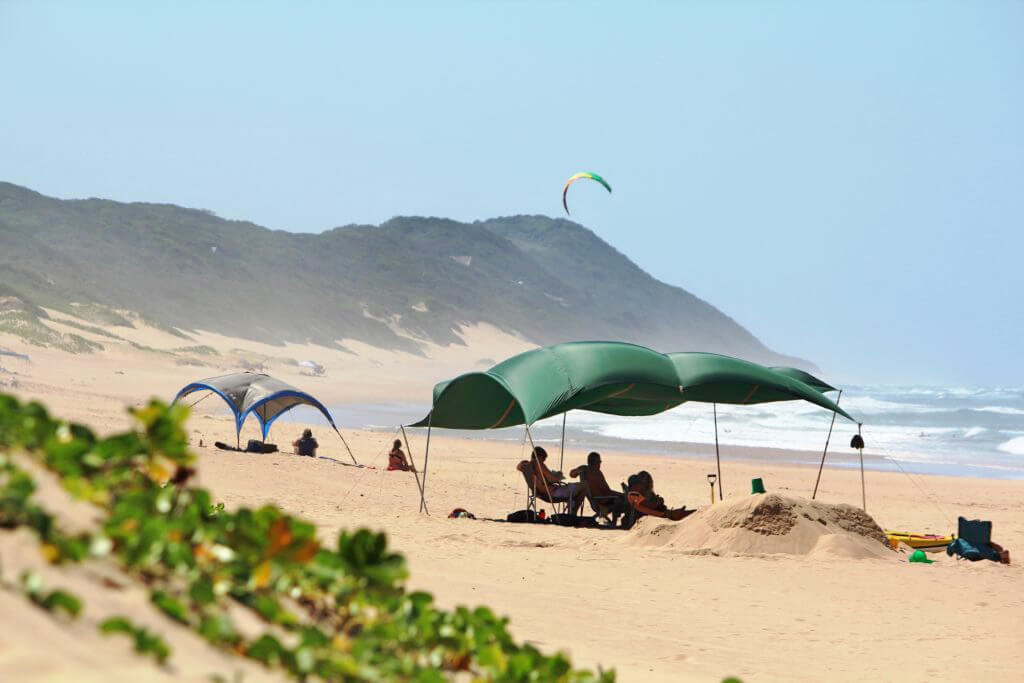 Beach at Ponta Malongane with tents on the sand